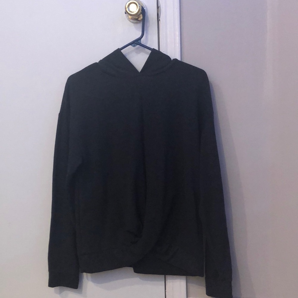 dark grey long sleeve tee with hood and twist at bottom